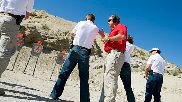 NRA Instructor helping students learn to shoot.